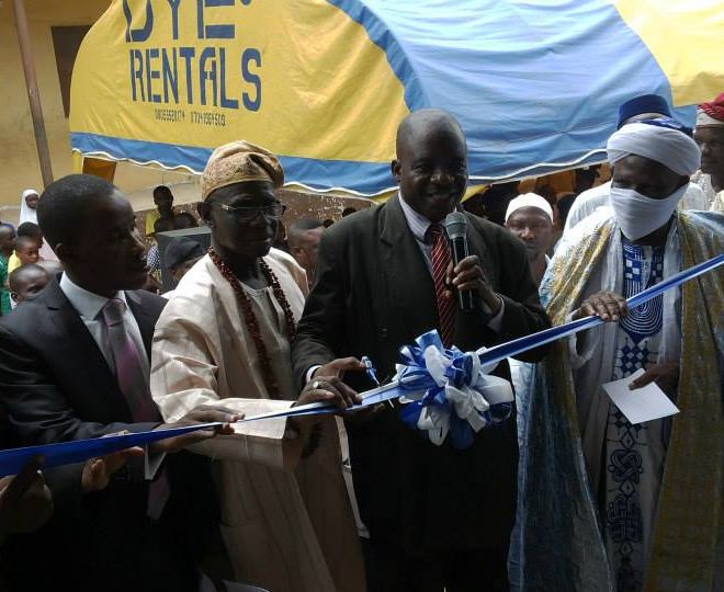 The Lead Pastor and his wife join the representative of the Commissioner for Education in cutting the tape